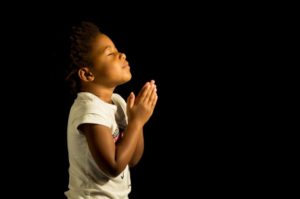 Praying African American Girl